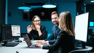 Detroit business professionals collaborating with IT support